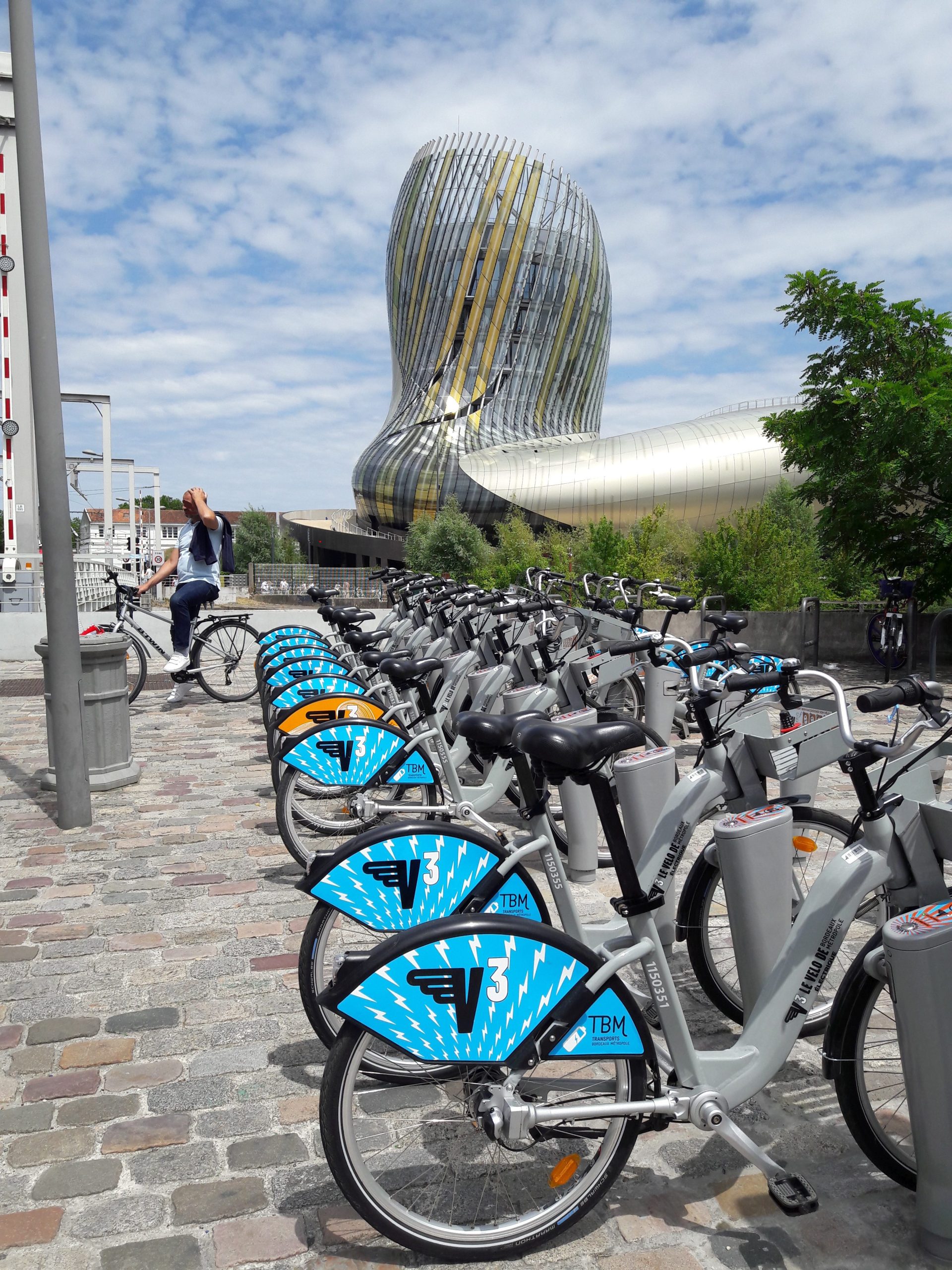 A row of V3 VCub hire bikes outside the cité du vin Bordeaux
